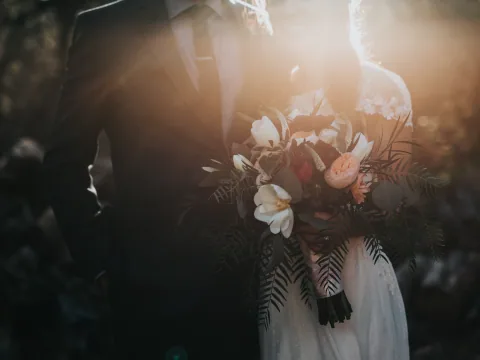 A newly married couple walking outside after their ceremony