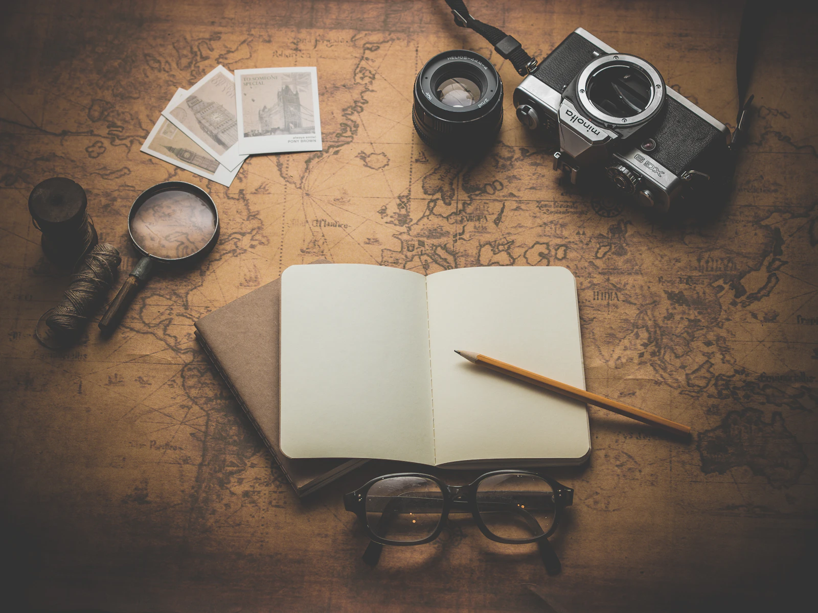 Old camp photographs and handwritten notes on a table