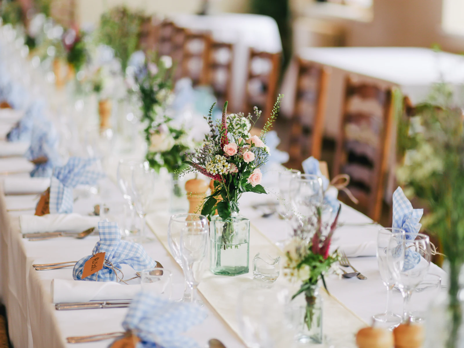 Elegant table details at a seaside wedding reception